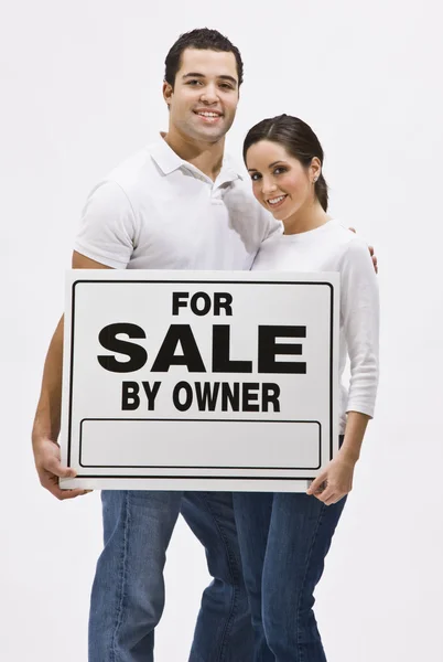 Couple With For Sale By Owner Sign — Stock Photo, Image