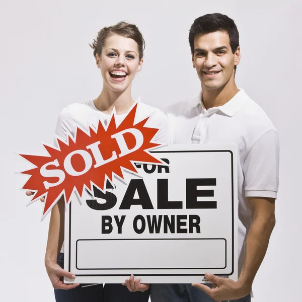 Couple with For Sale by Owner Sign — Stock Photo, Image