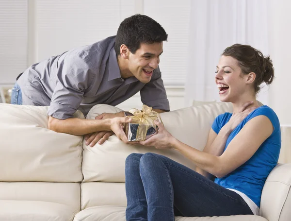 Woman laughing at gift — Stock Photo, Image