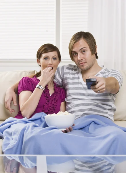 Couple on couch — Stock Photo, Image