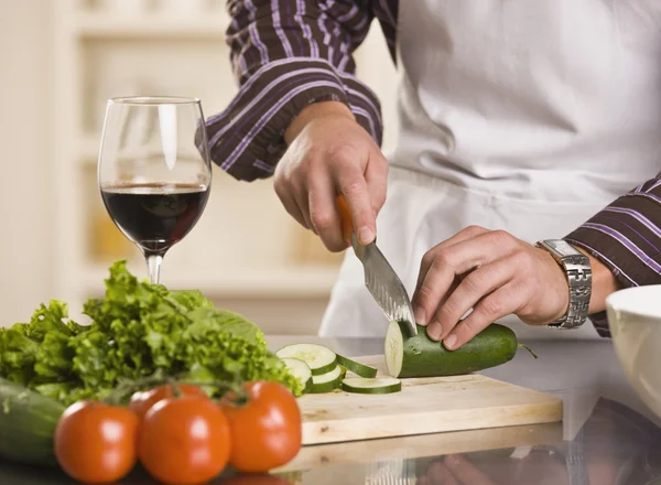 Male Slicing Cucumber for a Salad — Stock Photo, Image