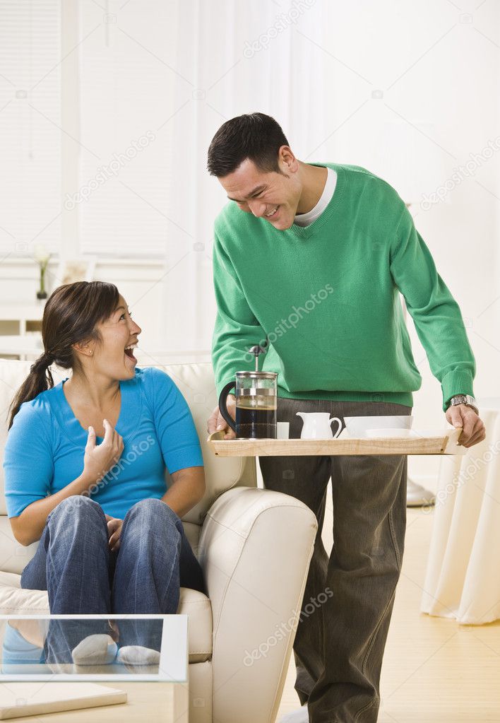 Happy Couple Having Coffee at Home