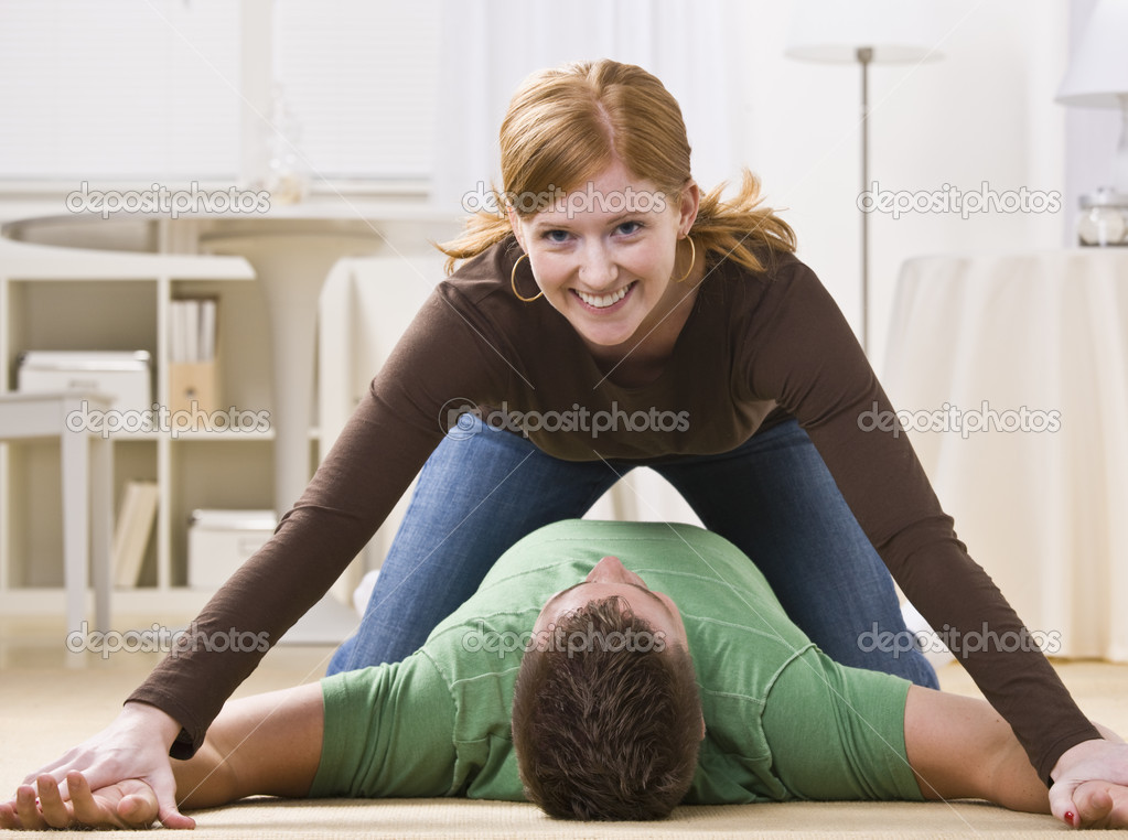 playful redhead pinning man stock photo spaces 18763285