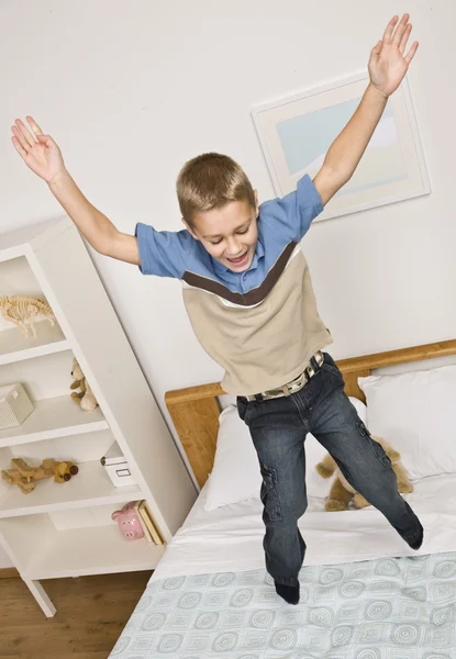 Boy Jumping on Bed — Stock Photo, Image