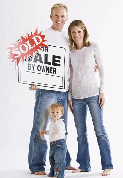 Family in Front of Sign — Stock Photo, Image