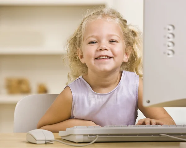 Girl on Computer Royalty Free Stock Photos