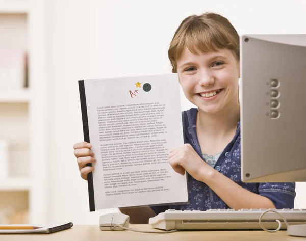 Girl Holding up Homework — Stock Photo, Image