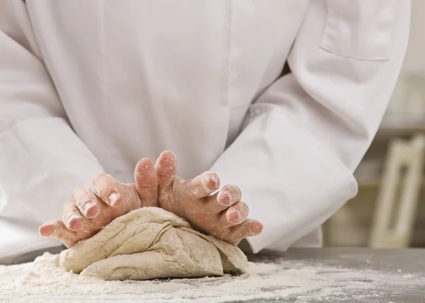 Chef kneading dough. — Stock Photo, Image
