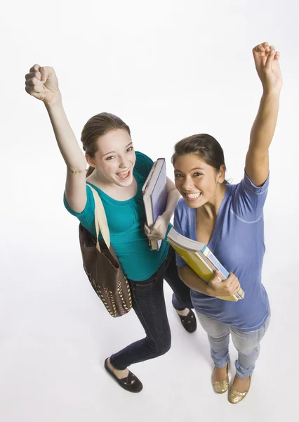 Students carrying books and cheering — Stock Photo, Image