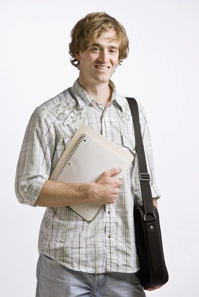 Estudante carregando livros e maleta — Fotografia de Stock