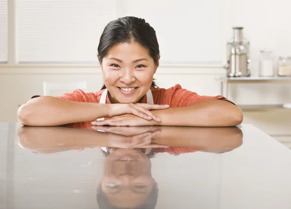 Woman Leaning on Counter Royalty Free Stock Images