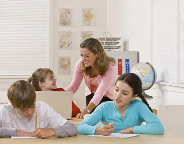 Teacher helping student Stock Picture