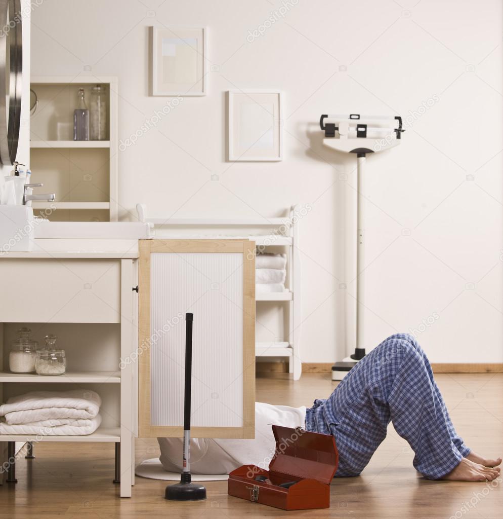 Man Fixing Sink