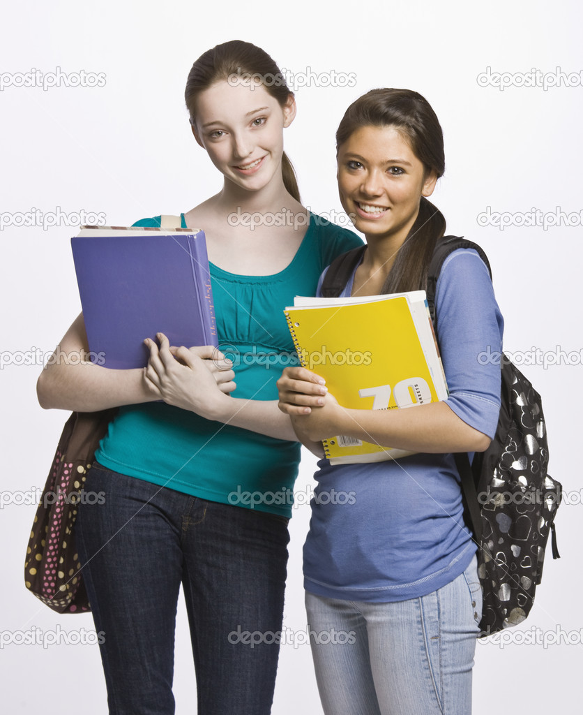 Students carrying book bag, backpack and notebooks