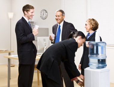 Business drinking water at water cooler clipart