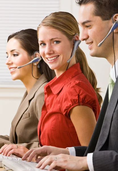 Business talking on headsets — Stock Photo, Image