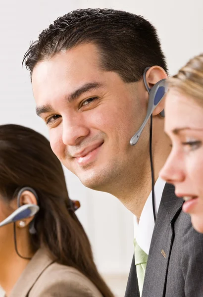 Business talking on headsets — Stock Photo, Image