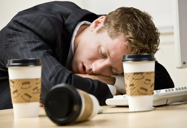 Businessman sleeping at desk — Stock Photo, Image