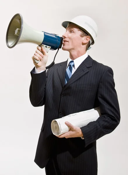 Businessman talking through megaphone — Stock Photo, Image