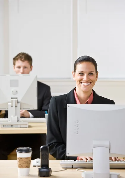 Business typing on computers — Stock Photo, Image