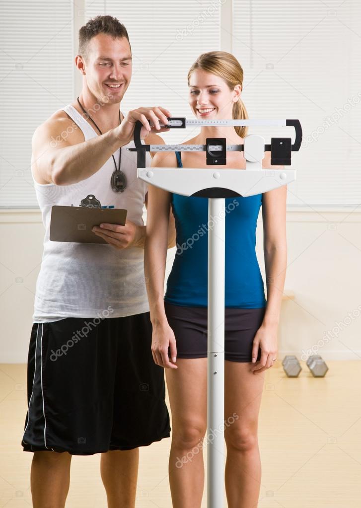 Personal training weight woman in health club