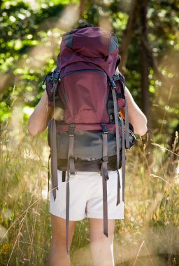 Woman with backpack hiking clipart
