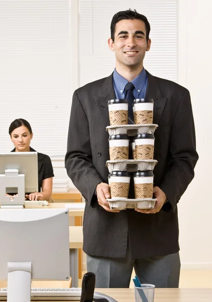 Businessman carrying tray of coffee — Stock Photo, Image