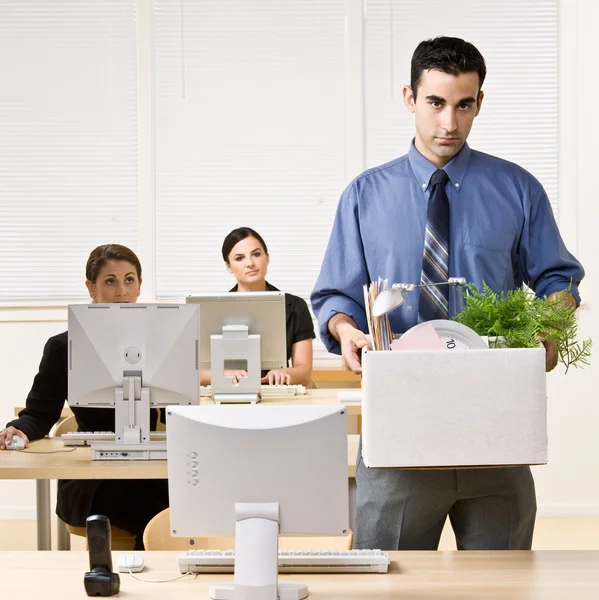 Fired businessman carrying box — Stock Photo, Image