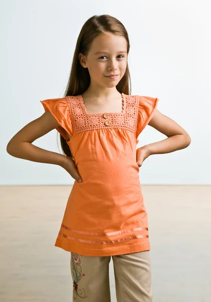 Skeptical girl with hands on hips — Stock Photo, Image