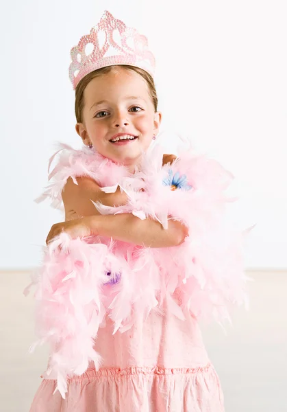 Young girl wearing crown and feather boa — Stock Photo, Image