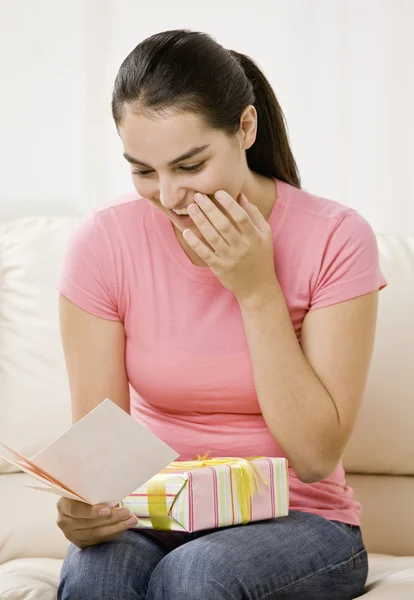 Young Woman Opening Gift — Stock Photo, Image
