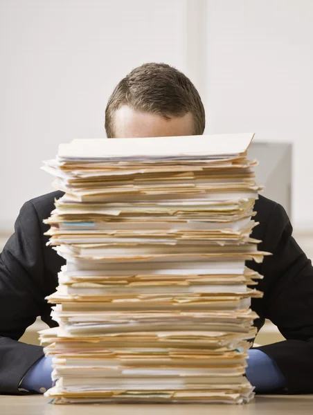 Businessman Behind Stack of File Folders — Stock Photo, Image