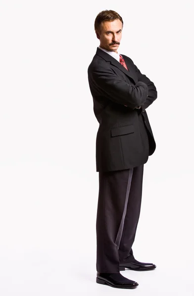 Stern businessman with arms crossed — Stock Photo, Image