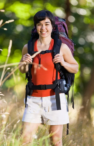 Smiling woman with backpack — Stock Photo, Image
