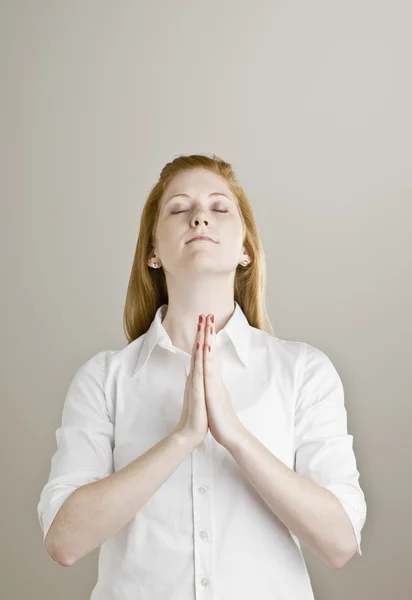 Young Woman Praying Stock Photo