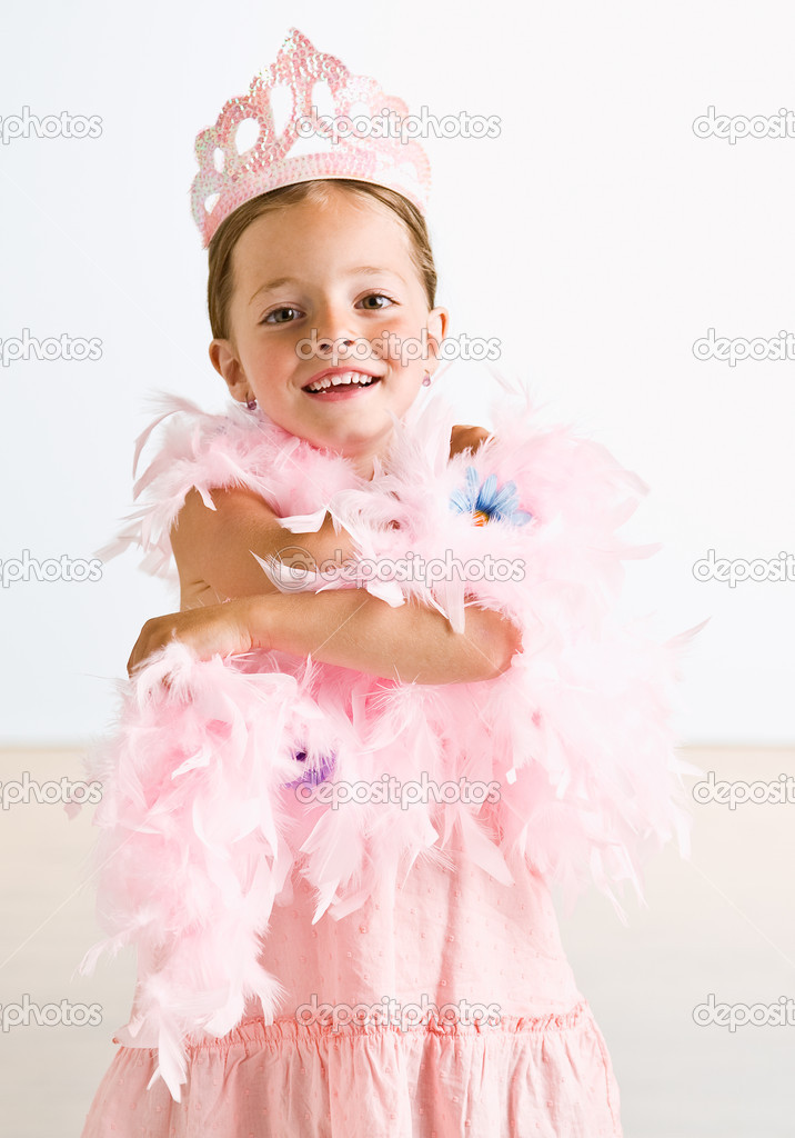 Young girl wearing crown and feather boa Stock Photo by ©Spaces 18801839