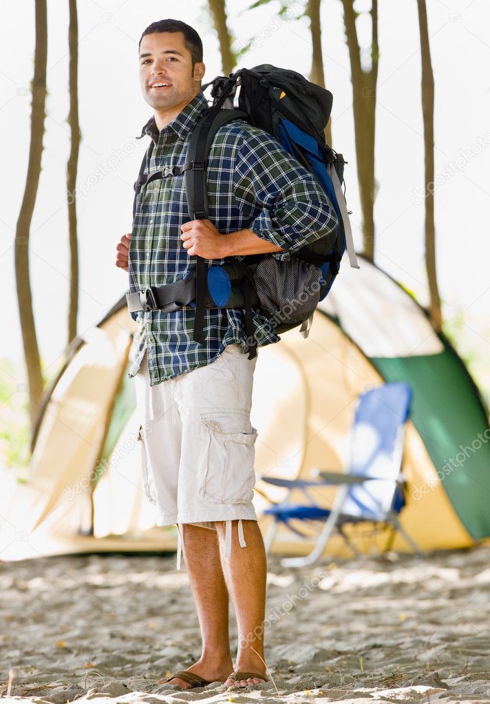 man carrying backpack