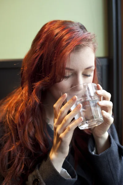 Young Woman with Beautiful Auburn Hair Drinking Water — Stock Photo, Image