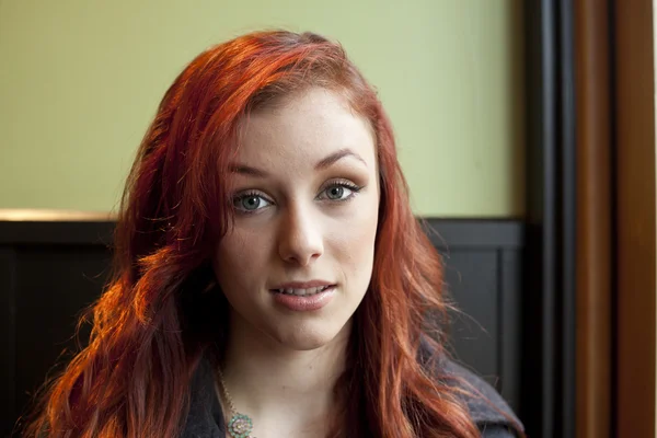 Young Woman with Beautiful Auburn Hair in Restaurant — Stock Photo, Image