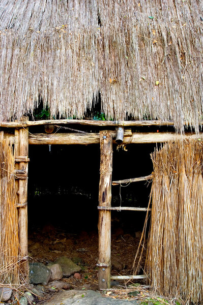 Photo of an entrance to a Kauhale--Traditional Hawaiian living site--at the Waimea Valley Audubon Center on Oahu, Hawaii