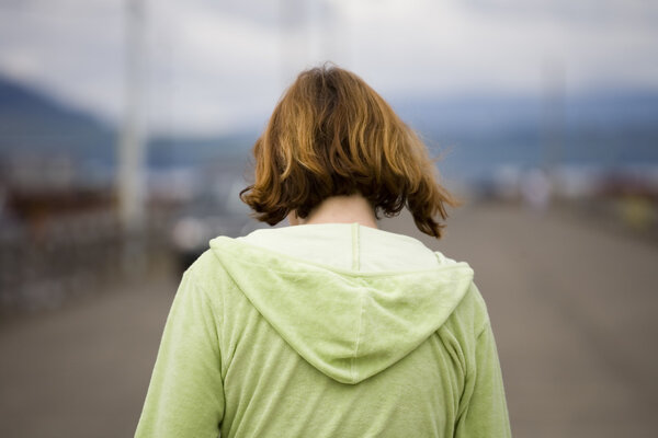 Woman Walking on a Pier