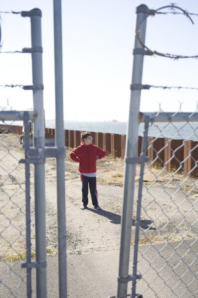 Boy on the Other Side of the Fence