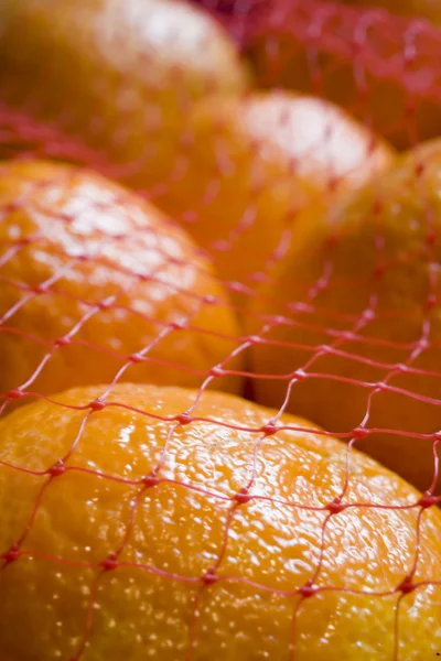 Oranges in Red Netting — Stock Photo, Image