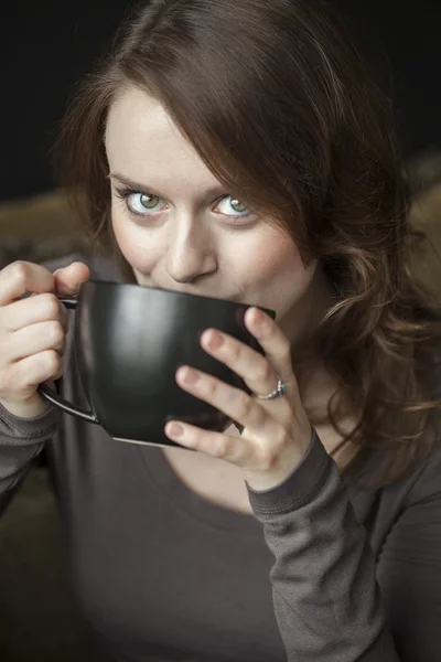Young Woman with Beautiful Green Eyes and Black Coffee Cup — Stock Photo, Image
