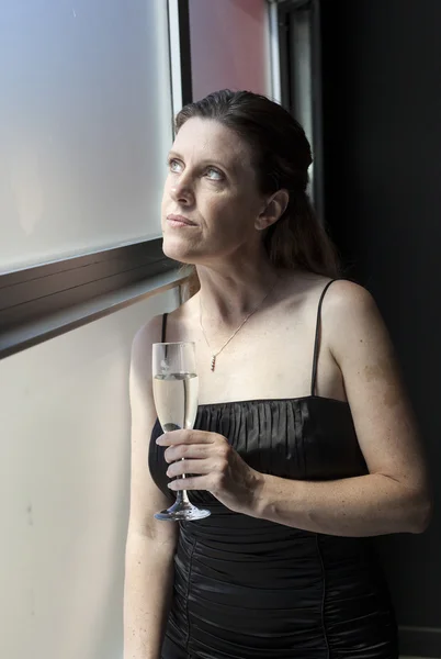 Middle Aged Woman in Black Dress with Champagne — Stock Photo, Image