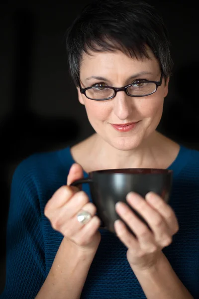 Beautiful Woman with Short Hair and Coffee Cup on Black Backgrou — Stock Photo, Image