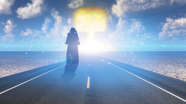 Black robed figure before mushroom cloud — Stock Photo, Image