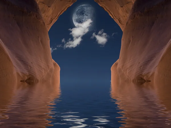 Пещера Красный камень с луной — стоковое фото