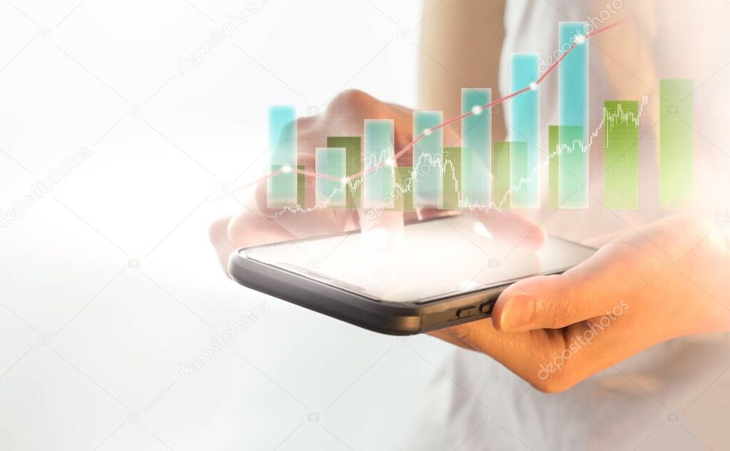 Growth chart positive indicators in business, smartphone in business, technology and the concept of people - a close-up of a female hand holding and showing a smartphone with a diagram on the scree