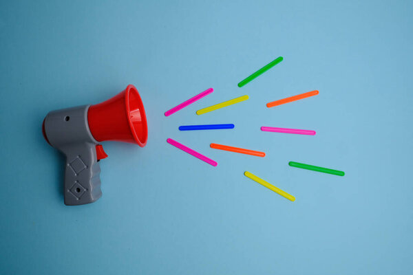megaphone on a blue  background in studio 